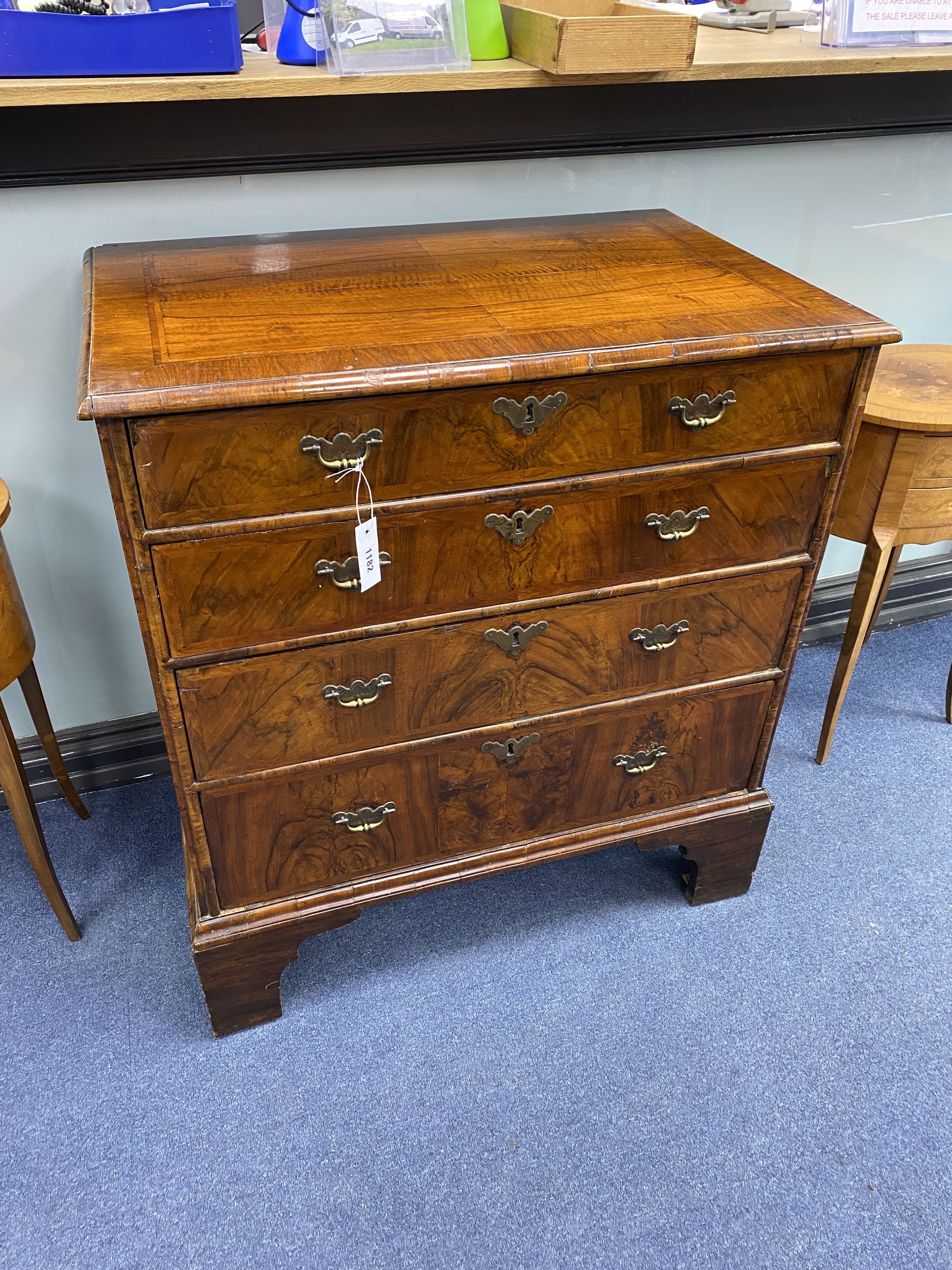 An 18th century and later walnut veneered chest of four graduating drawers raised on bracket feet, width 80cm, depth 52cm, height 88cm